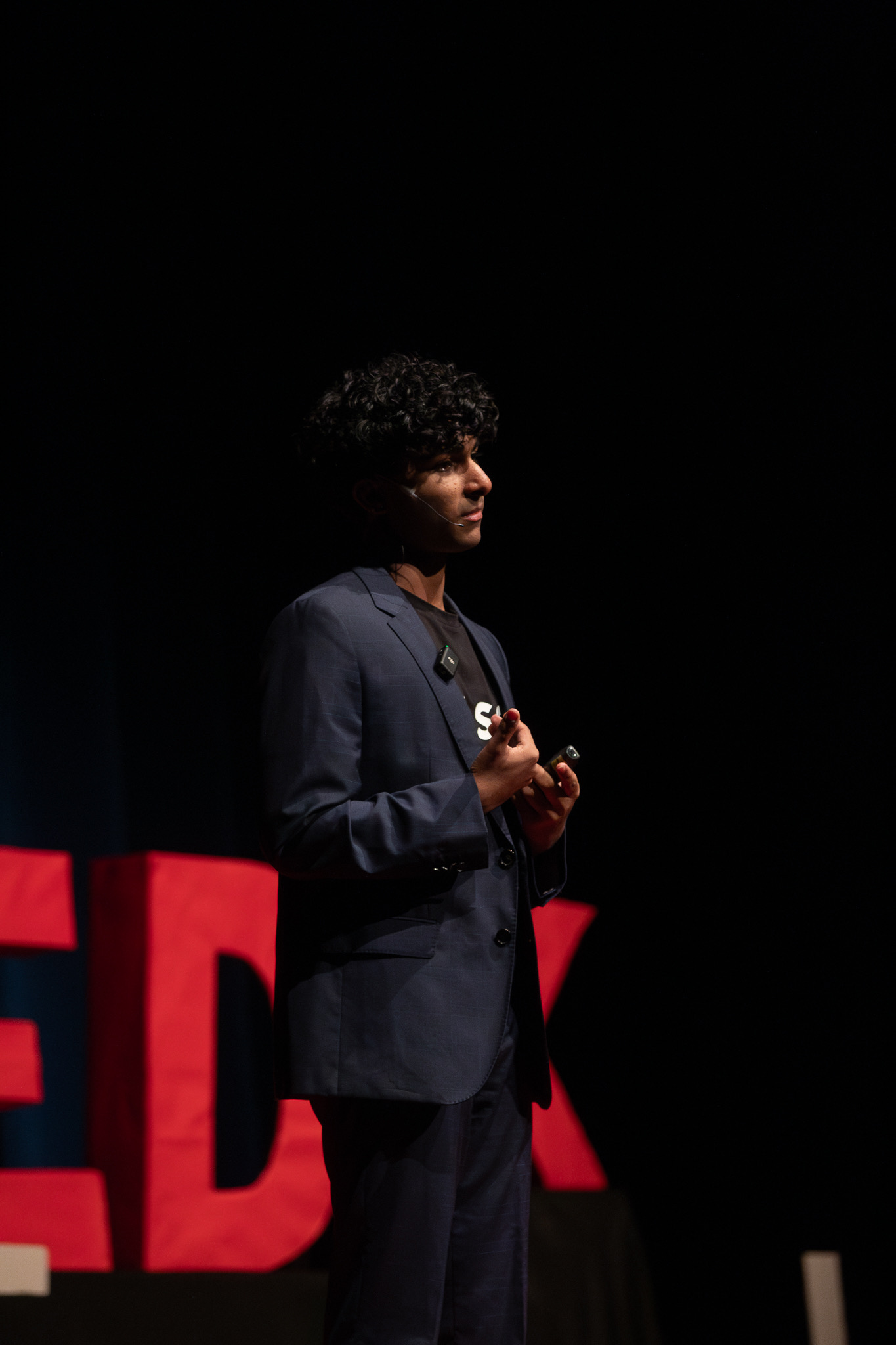 Ishaan speaking at a TEDx event